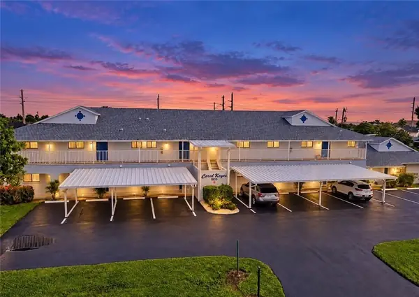1203 SW 48th Ter #202, Cape Coral, Coral Keyes building at twilight